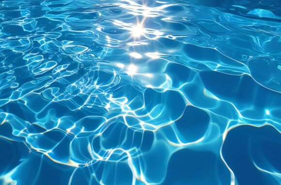 A Blue Water Surface with Sun Reflection: A Versatile Design Asset