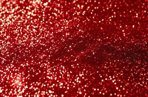 A Red Glittery Surface: Elevating Creative Projects with a Stunning Background