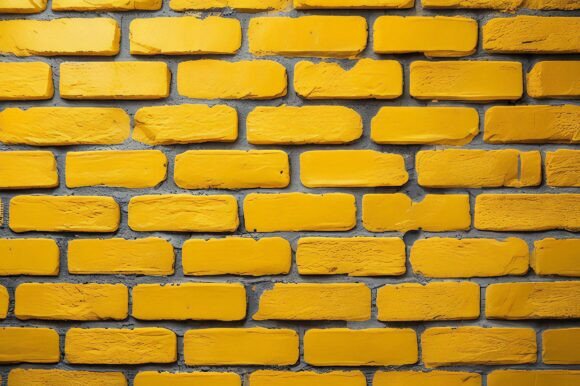 A Yellow Brick Wall with Cement: A Versatile and Visually Striking Background for Creative Projects